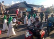 Bhabinkamtibmas Polsek Woha, Laksanakan Pengamanan Pawai Ta’aruf Pembukaan MTQ Tingkat Desa Samili ke-57