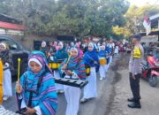 Polsek Ambalawi Amankan Karnaval HUT RI Ke-81, Arus Lalu Lintas Tetap Lancar
